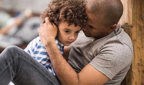 Image of a father hugging his child.