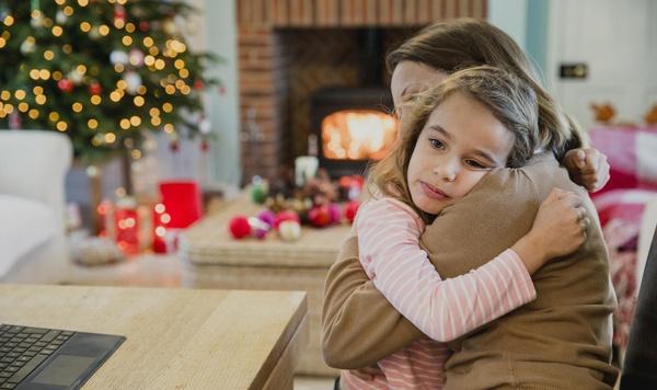Image of mother hugging and comforting daughter.