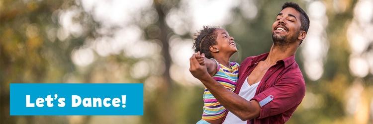 Image of father dancing with daughter.