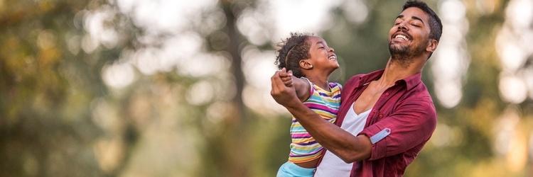 Image of father dancing with daughter.