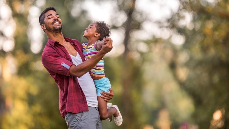 Image of father dancing with daughter.
