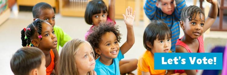 Children raising their hands.