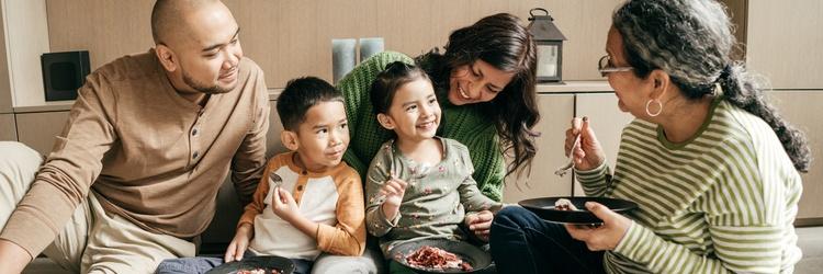 Image of family eating dinner together.