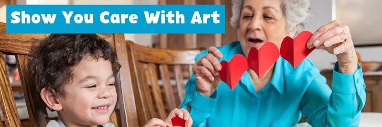 Grandmother and grandson doing Valentine's Day crafts.