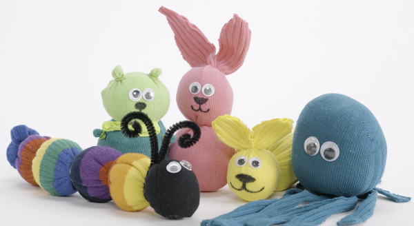 Sock animals on display, including a bunny, octopus, and caterpillar.